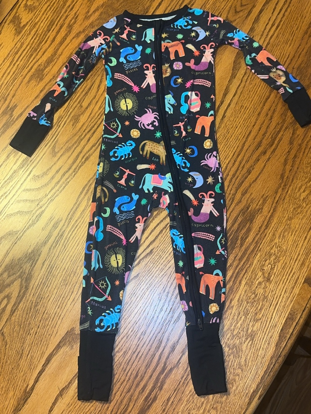 Little Sleepies Black Zodiac Print Footie with Colorful Accents